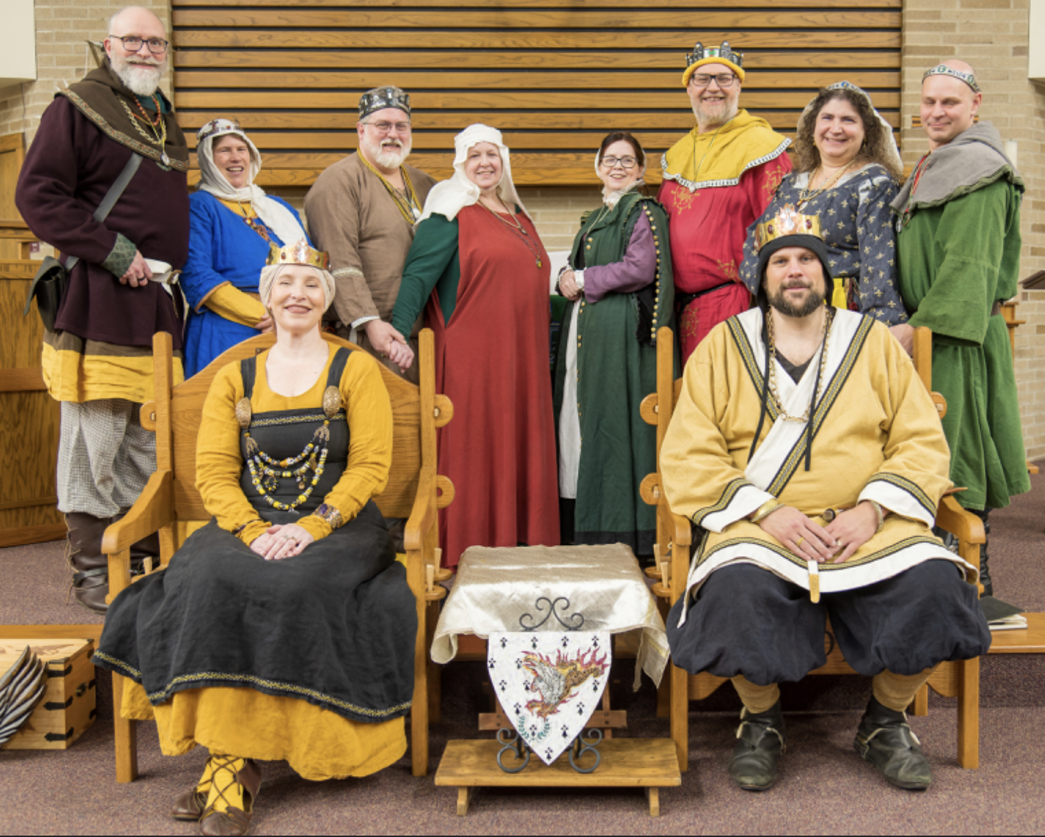 Baron and Baroness of the Flaming Gryphon with their court